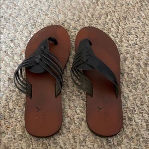 black leather flip flops
